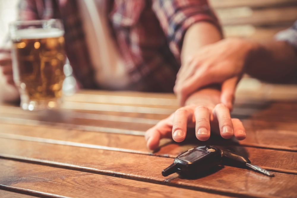 Person Reaching For Car Keys