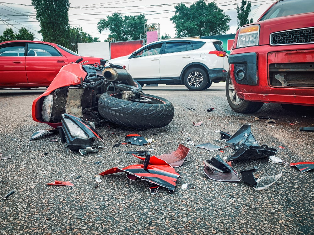 Crashed Red Motorcycle Laying On The Road