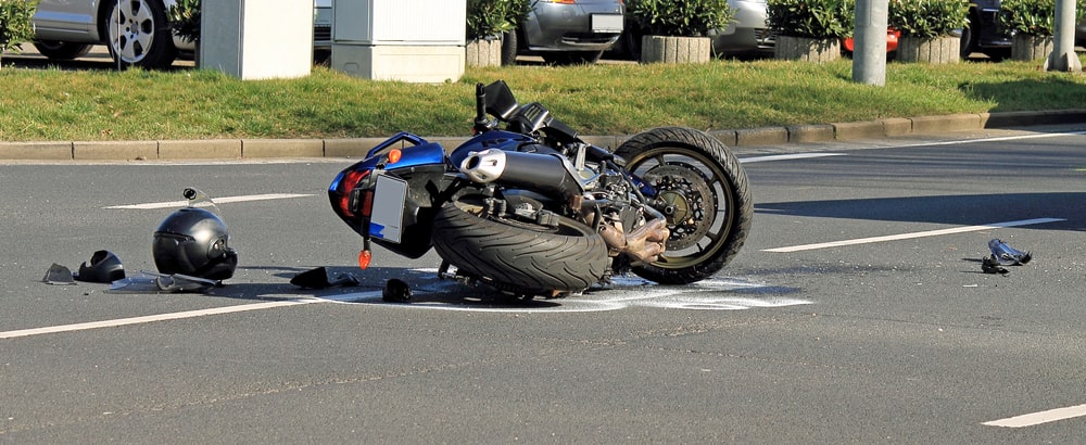 Blue Motorcycle Laying On The Floor
