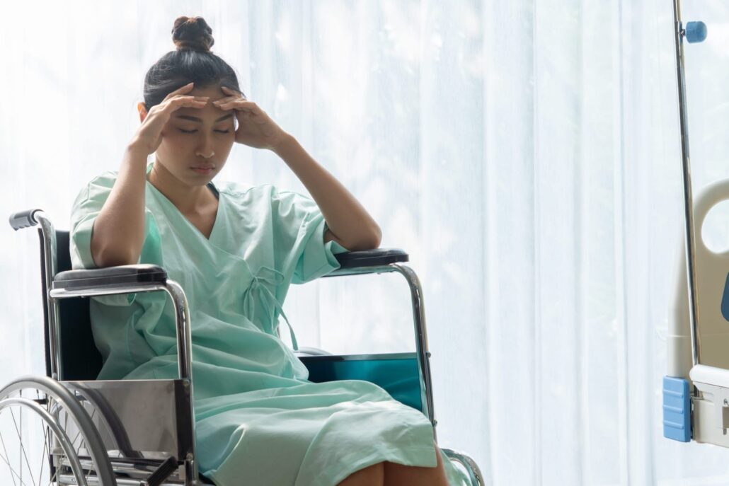 Medical Assistent Holding Her Head