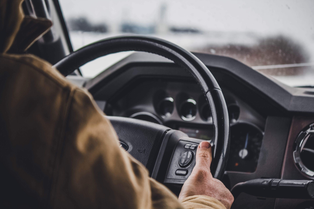 Photo of a Man Driving a Truck