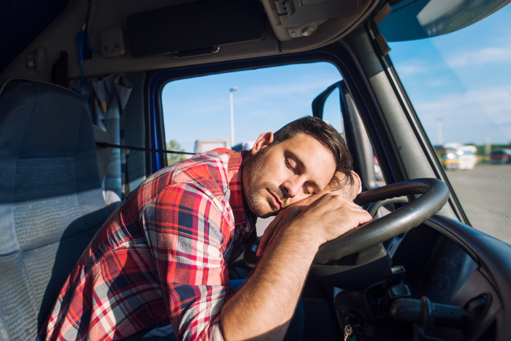Photo of a Exhausted Truck Driver