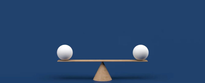 Two White Speheres On A Seesaw