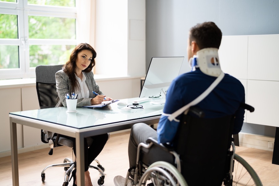 Man In A Wheelchair At An Attorneys Office