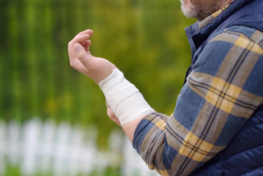 Man With His Arm Wrapped In Bandages