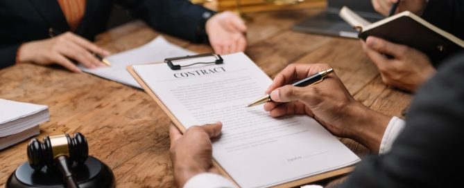 Lawyer And His Client Going Over Documents