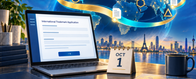 An international trademark application on a laptop connects to a globe beside an October 1 calendar.